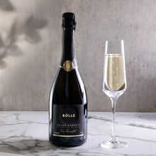 BOLLE Grand Reserve Blanc de Blancs non-alcoholic sparkling wine bottle with champagne flute on marble, world's only lees-aged alcohol-free wine