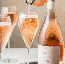 Pouring BOLLE Sparkling Rosé non-alcoholic wine into champagne flute, bubbles and effervescence of alcohol-free champagne
