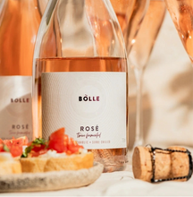 BOLLE Rosé twice-fermented non-alcoholic wine label close-up with appetisers, premium alcohol-free sparkling wine